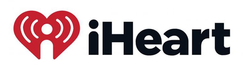 The iHeart logo features a red heart with radio waves and a person icon inside, next to bold black text “iHeart” on white—perfect for press release distribution or media coverage service to gain exclusive access to 500+ news outlets.
